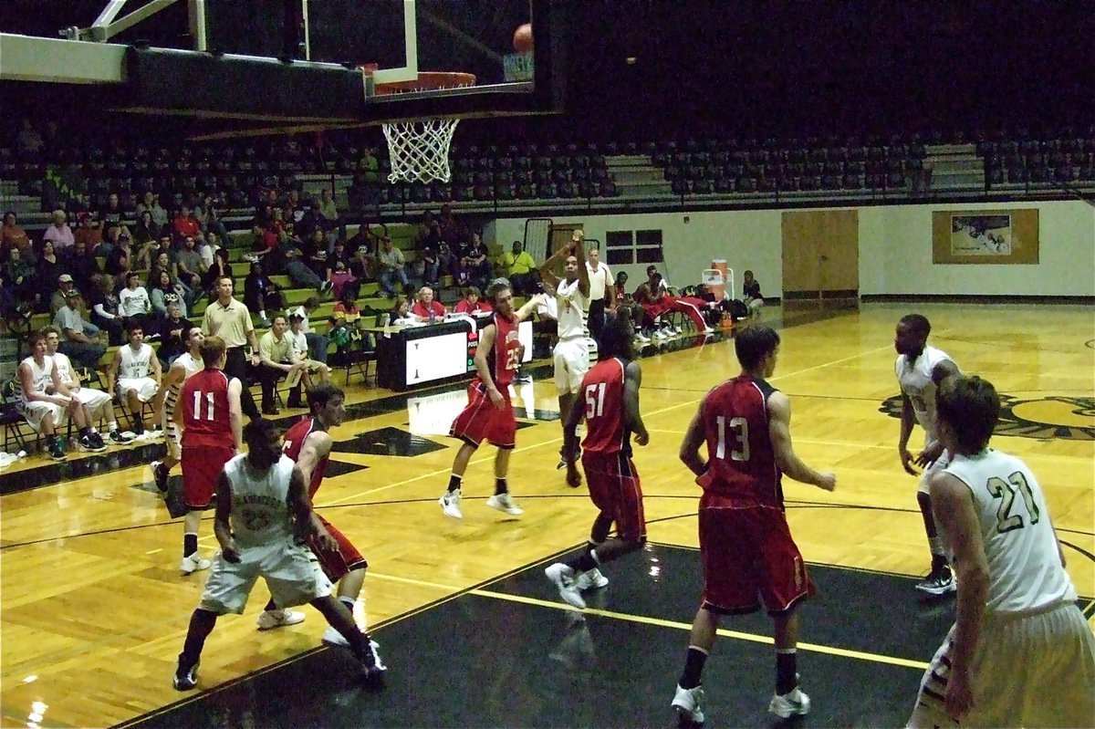 Image: Trevon Robertson(1) with another three-ball over Axtell.