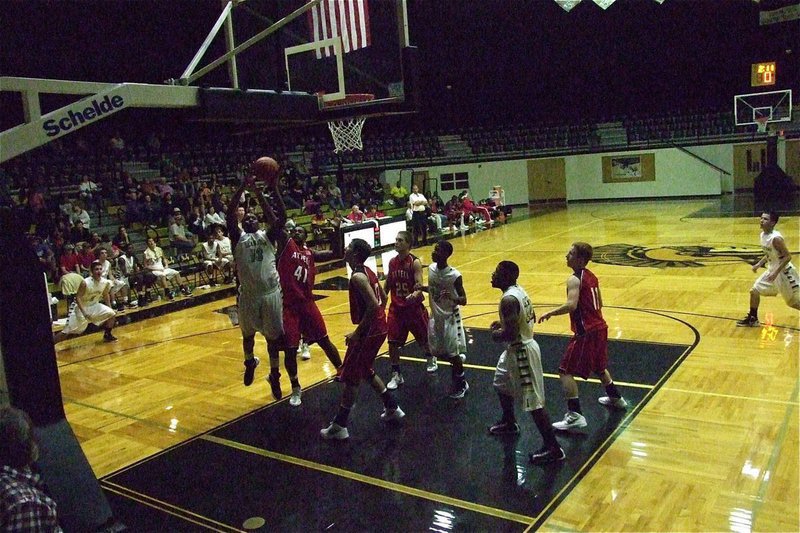 Image: Larry Mayberry, Jr.(13) scores down low and finishes with 13-points against Axtell.