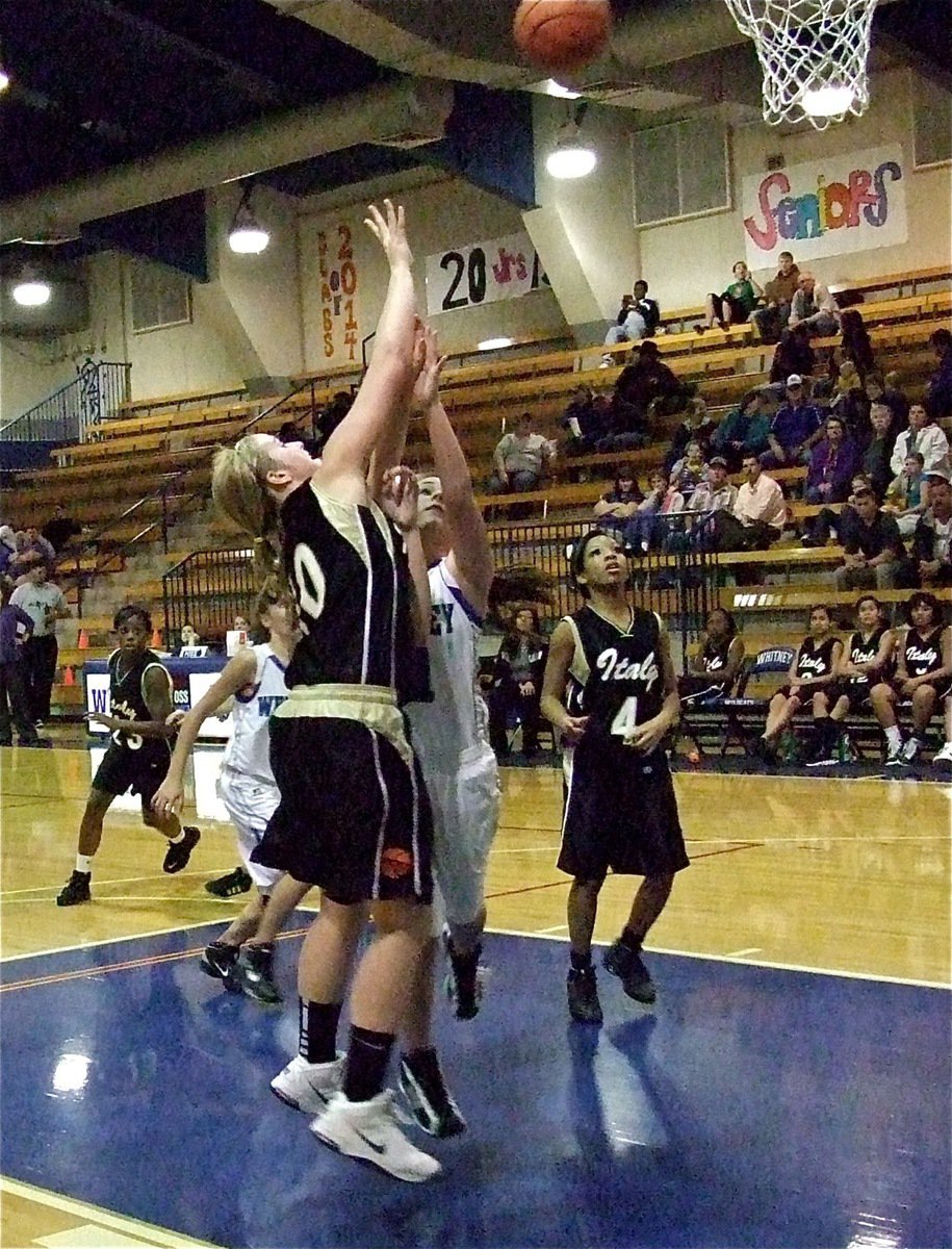 Image: Madison Washington(10) scores inside against Whitney with teammates Ryisha Copeland(4)  and Kourtnei Johnson(23) rushing in for the rebound during JV girls’ action.