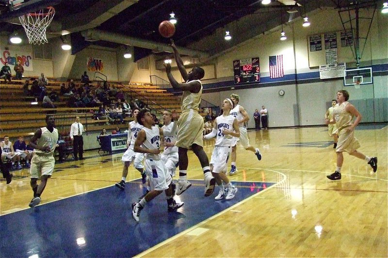 Image: JV Gladiator Marvin Cox(1) scores against the Wildcats.