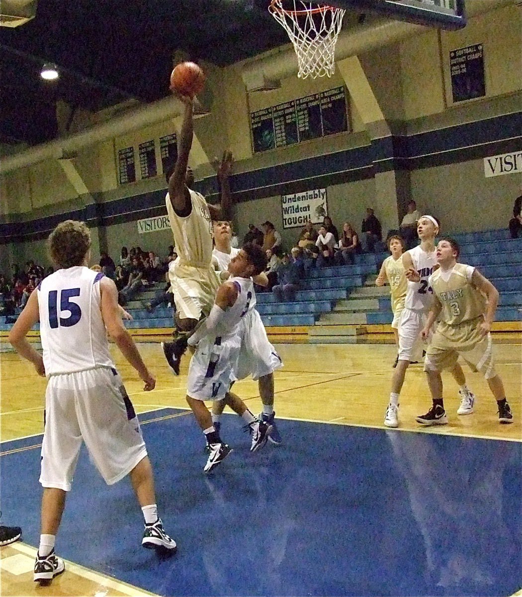 Image: JV Gladiator Tyvion Copeland(4) elevates his game as the tension mounts against Whitney.