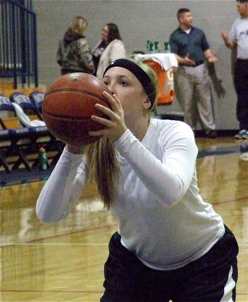 Image: Freshman Jaclynn Lewis eyes the rim during warmups before the Lady Gladiators take on Whitney.