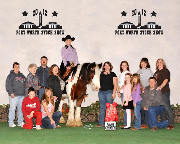 Image: Members of the Flying Dollar Ranch fan club were on hand to pose in the GHRA Reserve World Champion Trail and English win photo. Photo by Larry Williams Photography.