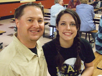 Image: Coach Ward and fiance, Jessica Simon, enjoyed the hamburgers with the community.