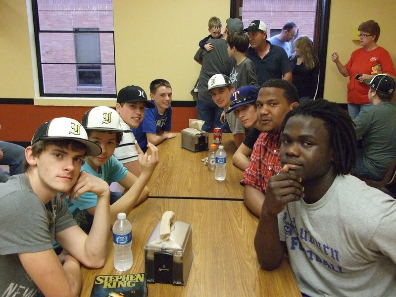 Image: The baseball team and friend help with the hamburger fundraiser Friday night.
