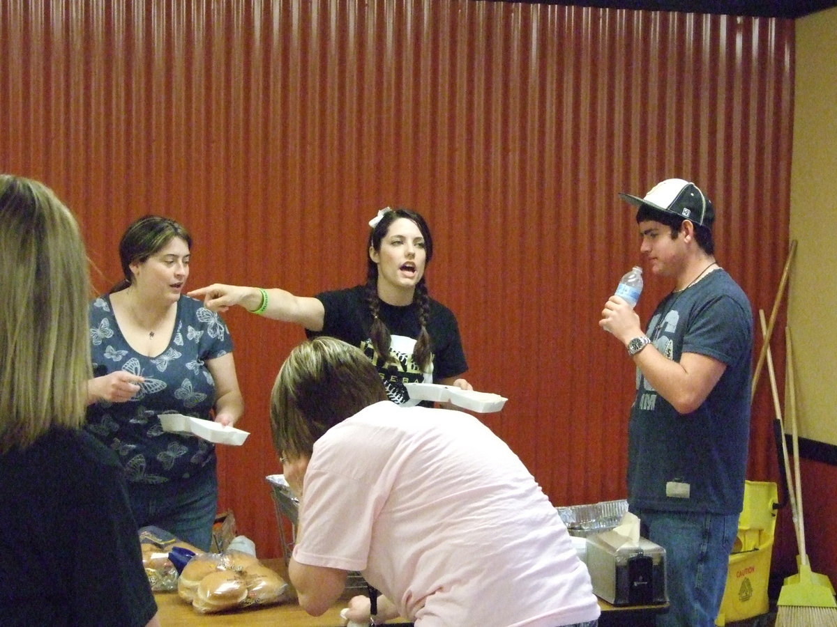 Image: Jessica and other baseball parents work hard at the fundraiser.