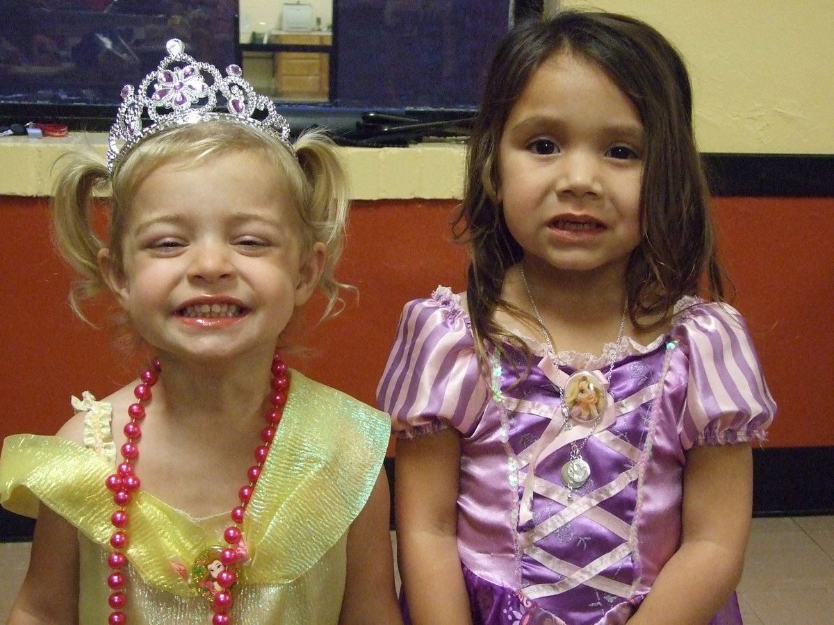 Image: Avery and Olivia dressed for the successful hamburger fundraiser the Gladiator Baseball team sponsored.