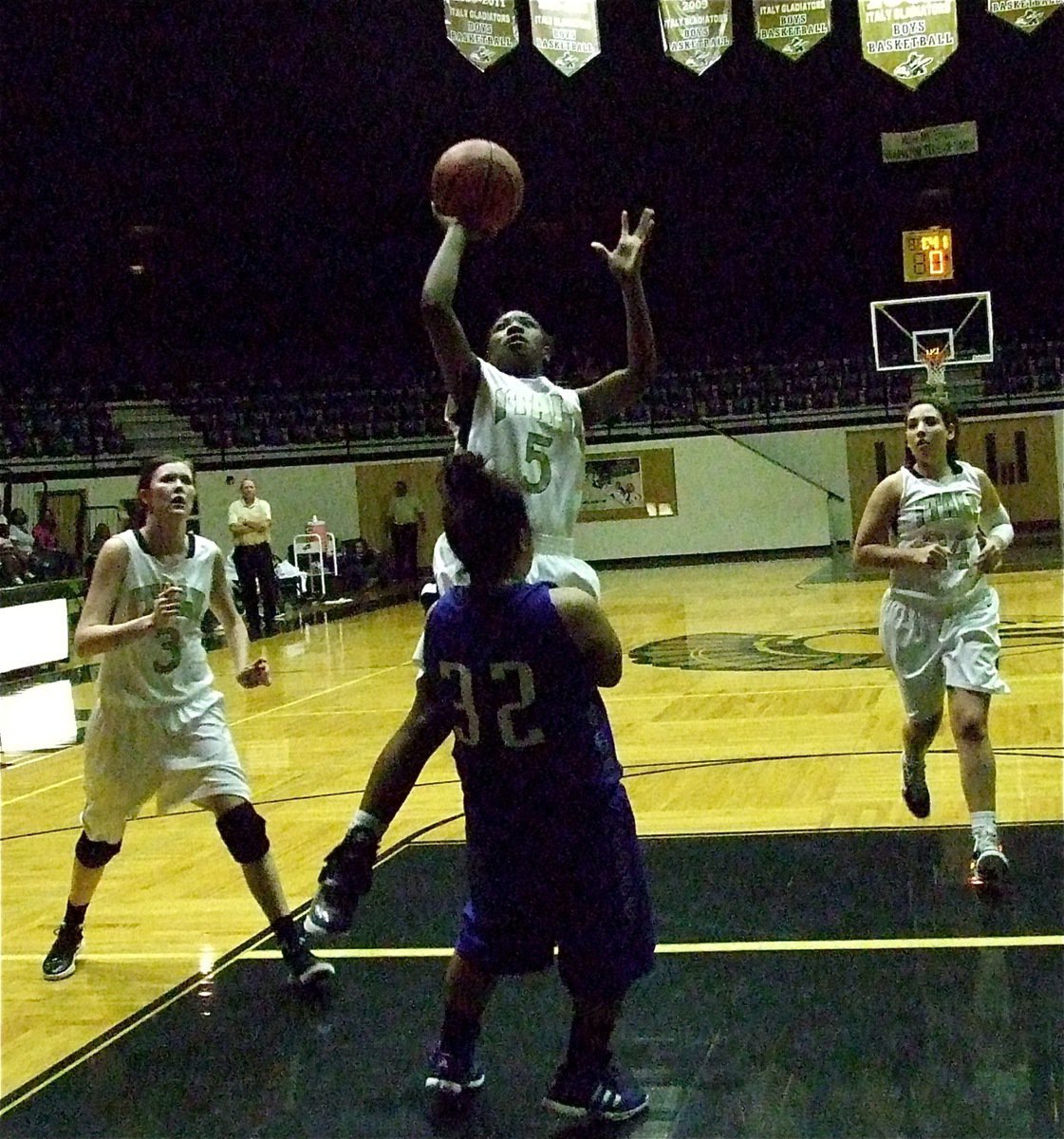 Image: Lady Gladiator Jameka Copeland(5) attacks the basket against the Keene Lady Chargers with teammates Kaitlyn Rossa(3) and Alyssa Richards(24) trailing the play.