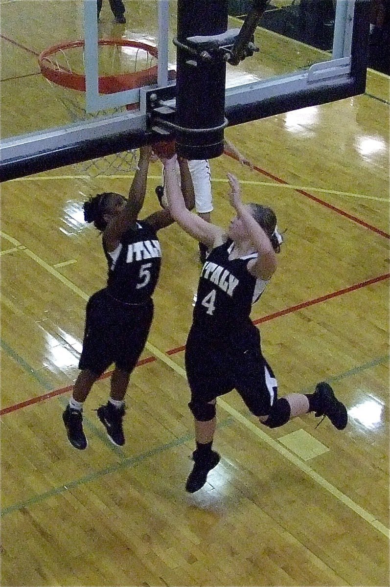 Image: Lady Gladiators’ Jameka Copeland(5) and Jaclynn Lewis(4) sky for a rebound against Grandview in their team’s final game of the season.