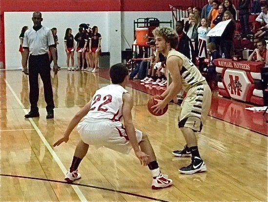 Image: Gladiator Brandon Souder looks to pass against the Maypearl defense.