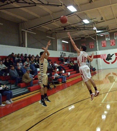 Image: Gladiator Reid Jacinto(5) let a three-ball fly with a Panther’s paw in his view.