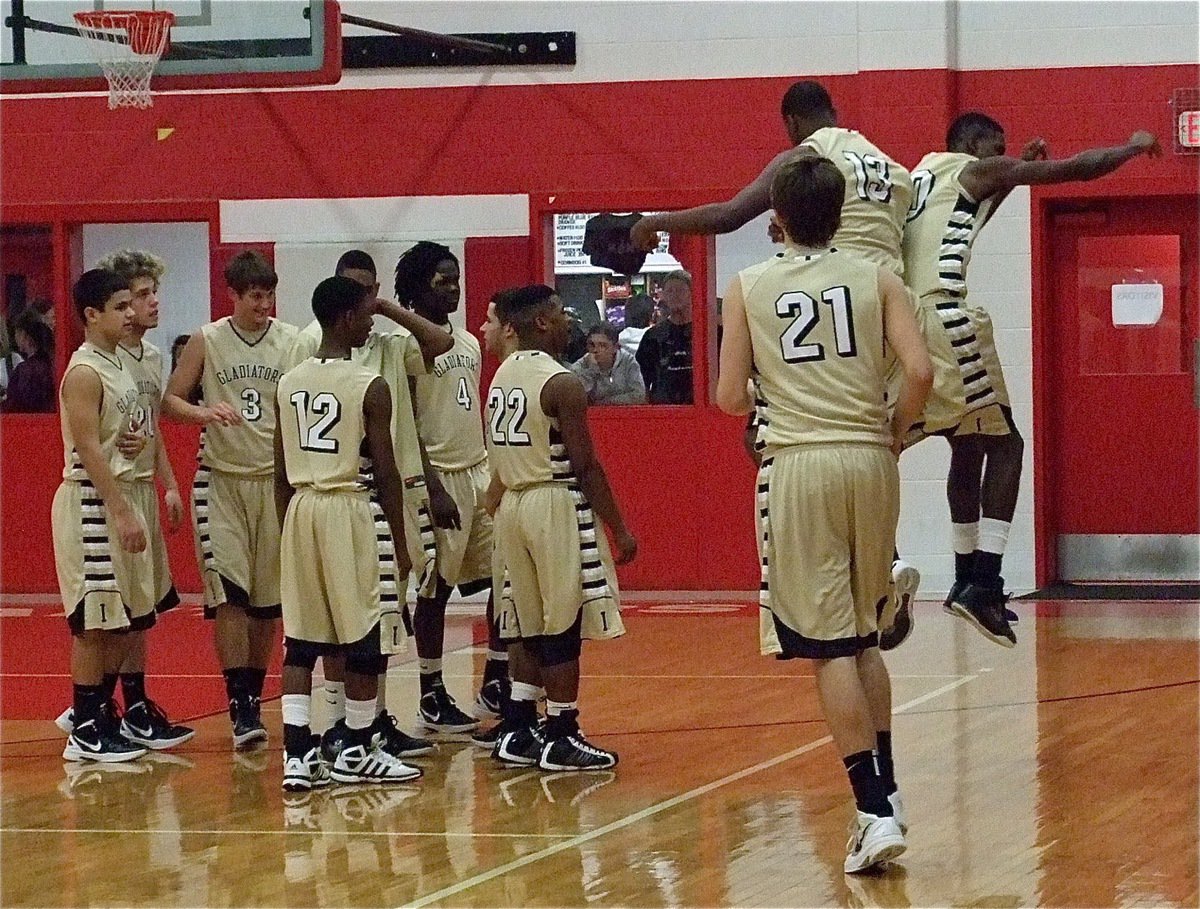 Image: Gladiators’ Larry Mayberry, Jr.(13) and Devonta Simmons(10) try to get their team pumped up after pre-game introductions in Maypearl.