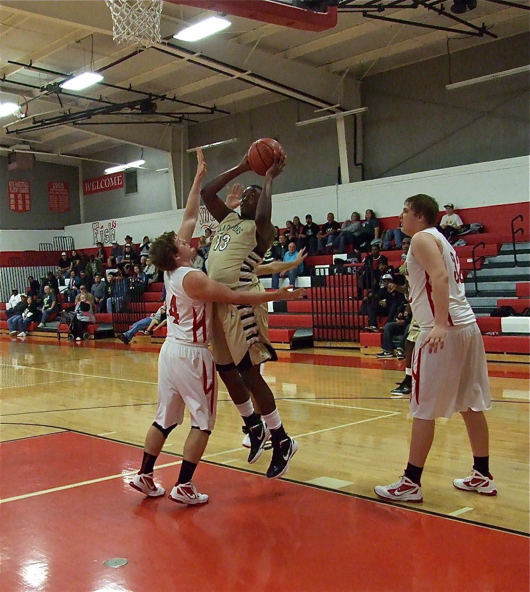 Image: Gladiator Larry Mayberry, Jr.(13) has all the right moves on the low block.