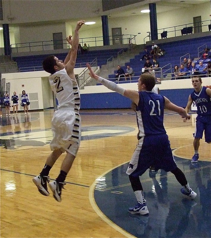 Image: Gladiator Caden Jacinto(2) attempts a three-pointer over the Wildcat defense.