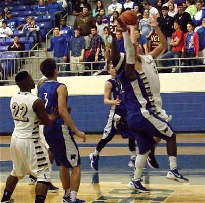 Image: Gladiator Cole Hopkins(21) tries to power his way toward the basket.