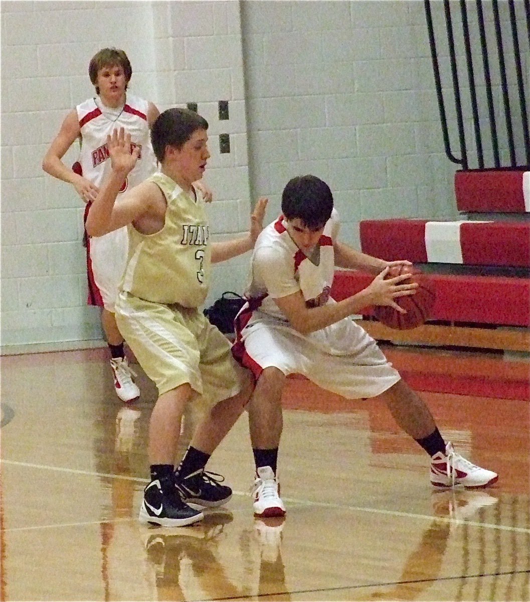 Image: Italy’s John Escamilla(3) pesters a Maypearl dribbler.