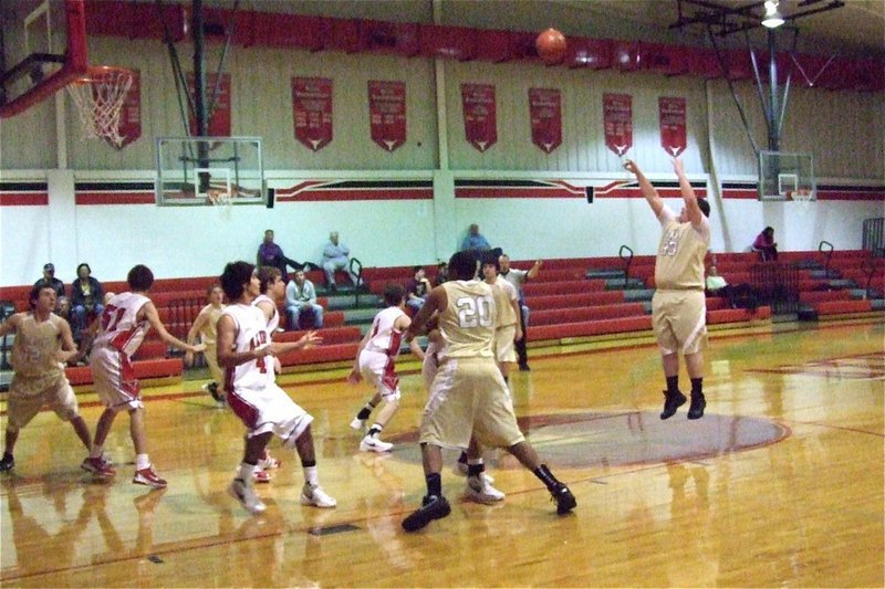 Image: John Byers(33) banks in a 10-footer over Axtell’s tight zone defense.