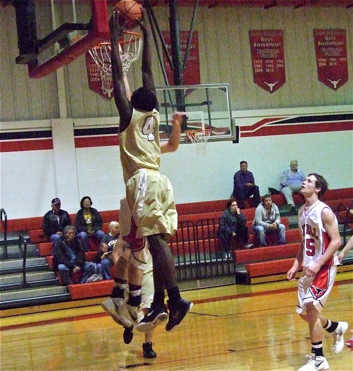 Image: Going for the slam during Italy’s JV game against Axtell is Tyvion Copeland(4).