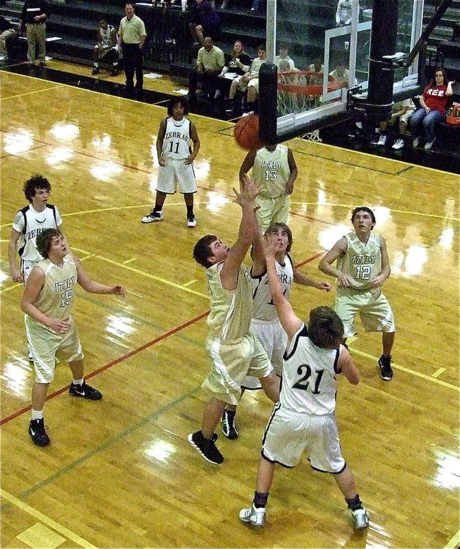 Image: Zain Byers(5) crashes the offensive boards for Italy.