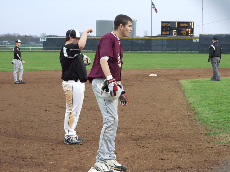 Image: John Byers covers third base.