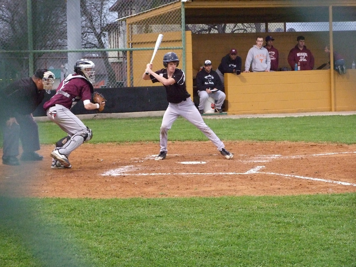 Image: Justin Wood watches the ball all the way.