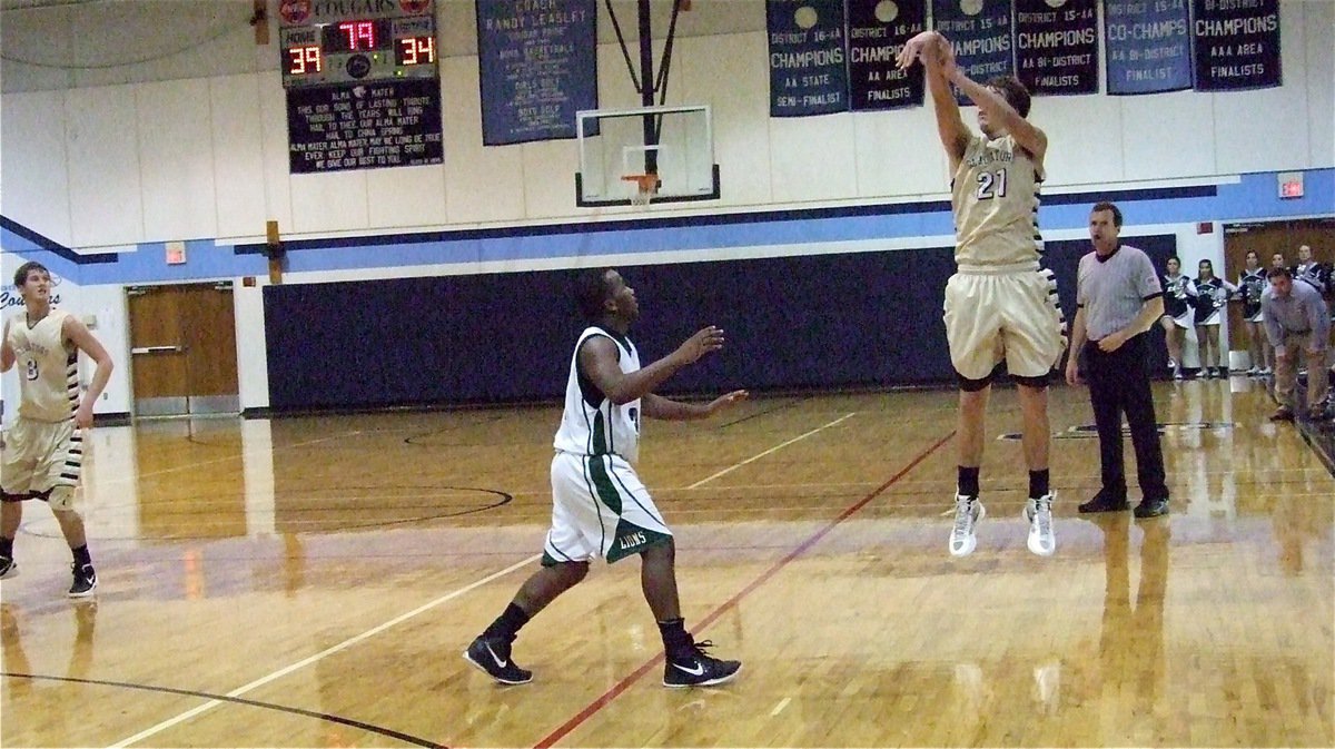 Image: Cole Hopkins(21) tries a long three-pointer with the third-quarter winding down and Franklin up by five.