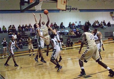 Image: Larry Mayberry, Jr.(13) goes up for the shot while Devonta Simmons(10) heads in for the rebound.