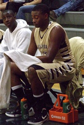 Image: Larry Mayberry, Jr.(13) takes a breather next to Marvin Cox.