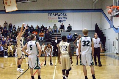Image: Cole Hopkins(21) puts in a free-throw late in the contest as teammate Eric Carson(21) watches it drop in.