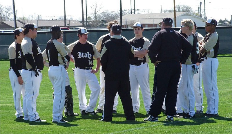 Image: Coach Ward and coach Randy Parks talk with the club after the Palmer game.