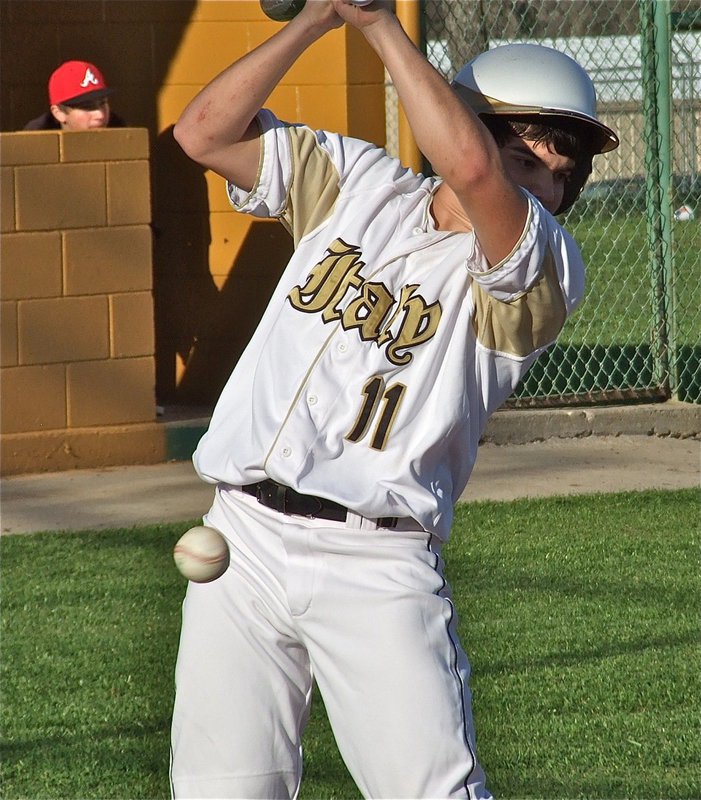 Image: Tyler Anderson(11) gets nicked by pitch inside and takes his base.