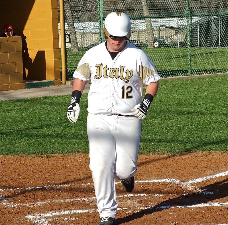 Image: John “Curly” Byers(12) nonchalantly crosses home plate.