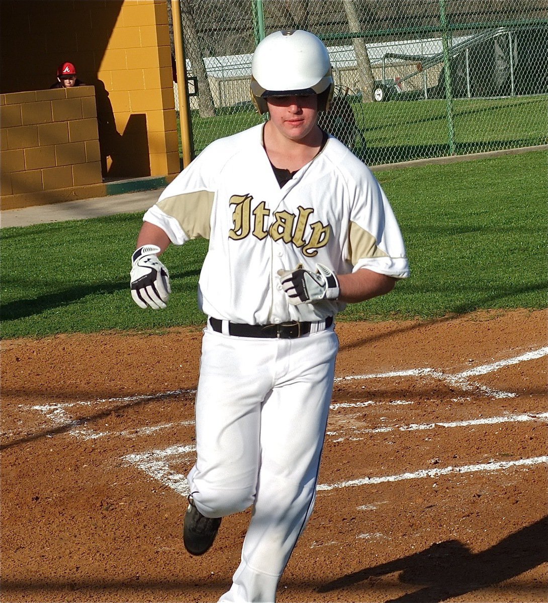 Image: Kyle Fortenberry(14) crosses home plate for Italy.