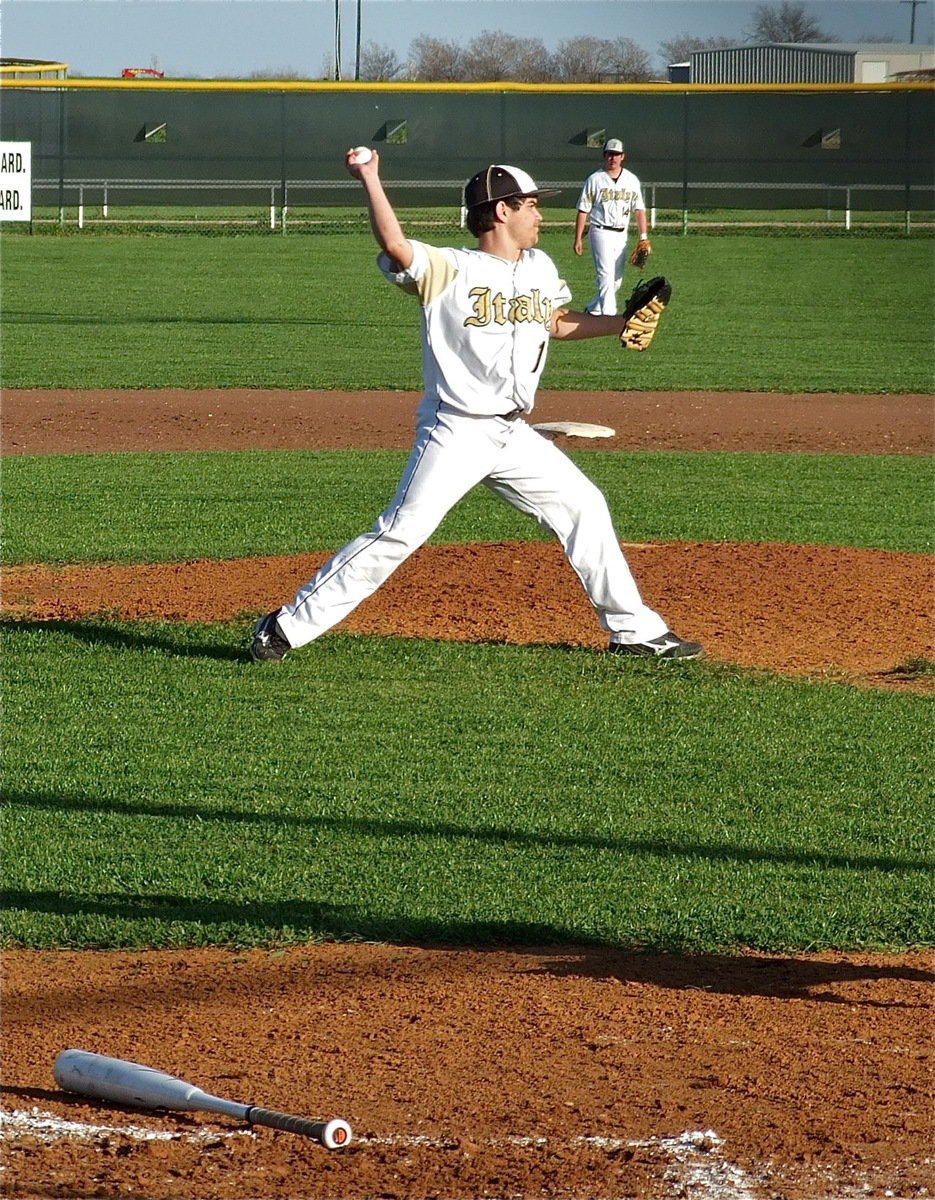 Image: Pitcher Tyler Anderson turns a dink back to the mound into an out to first baseman Kevin Roldan.