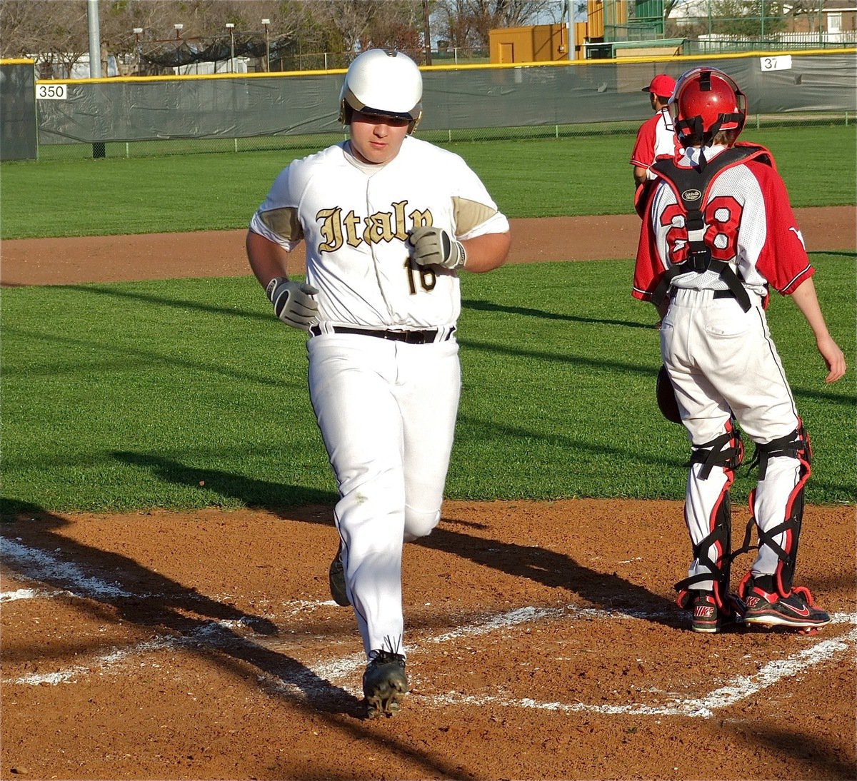 Image: Kevin Roldan(16) puts another run on the board for Italy.