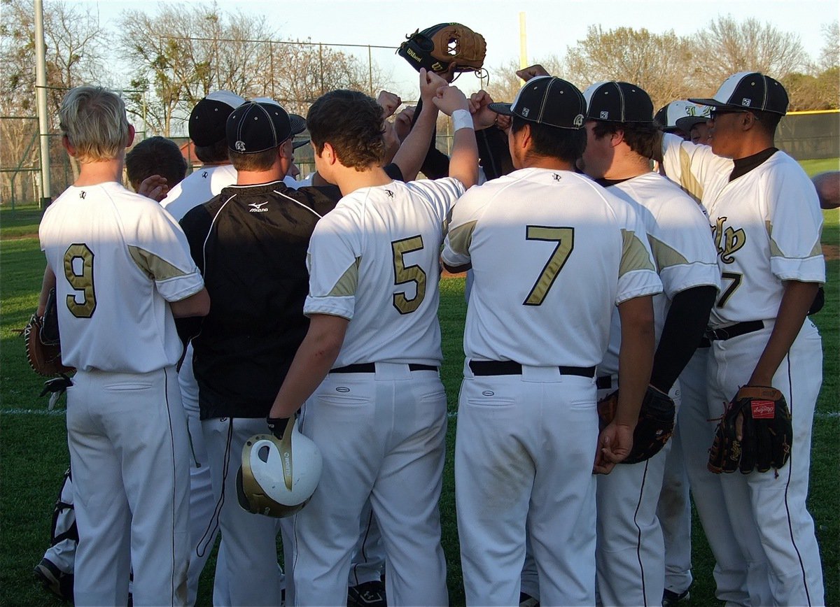 Image: Head coach Josh Ward brings his team together before making their final push to close out the win.