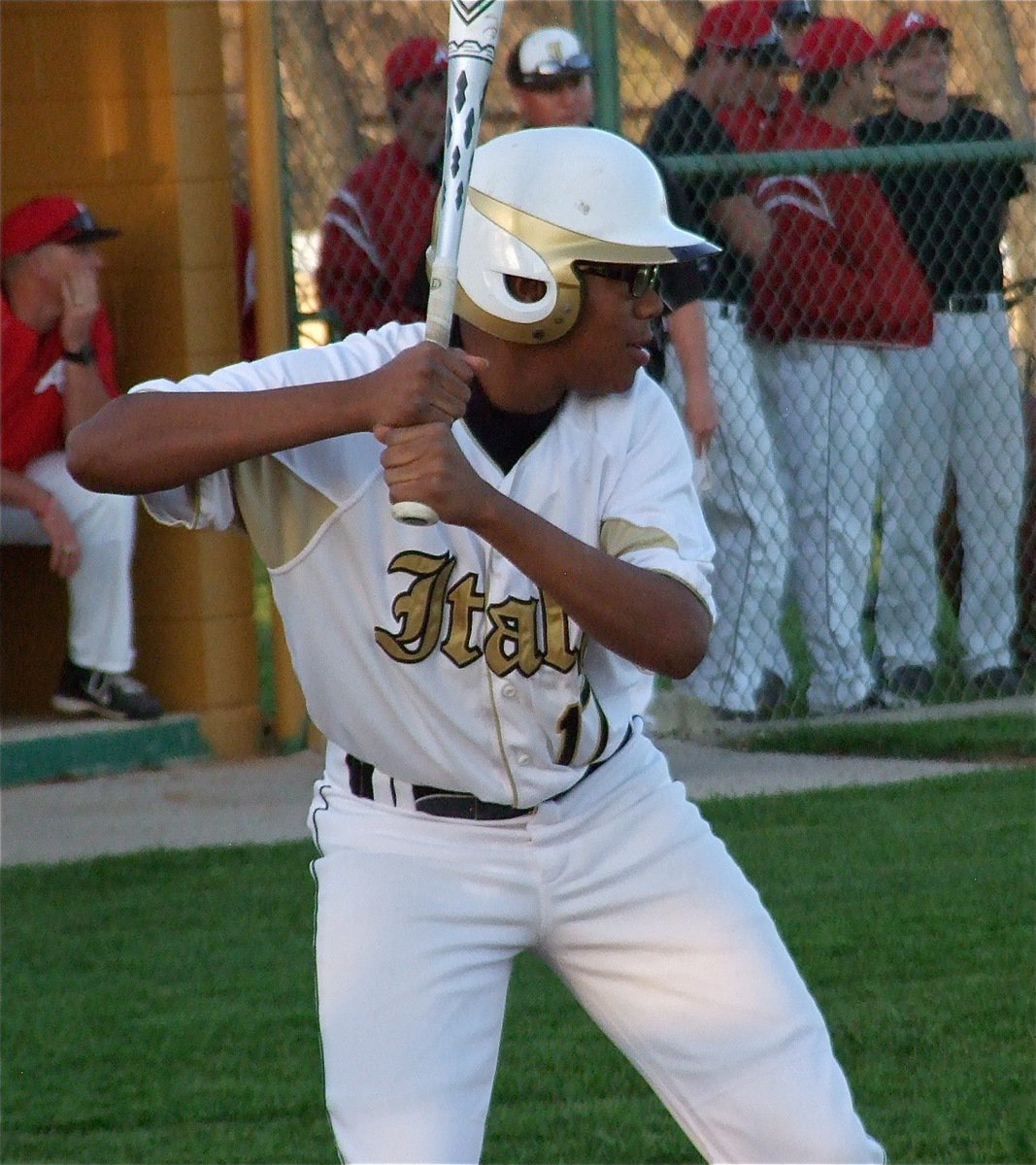 Image: John “Squirt” Hughes(17) gives Axtell’s pitcher a workout during Italy’s last at bat.