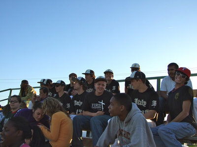 Image: The varsity in the stands watching the JV game.