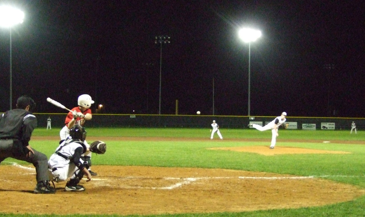 Image: Senior Justin Buchanan brings the heat to the ballfield.