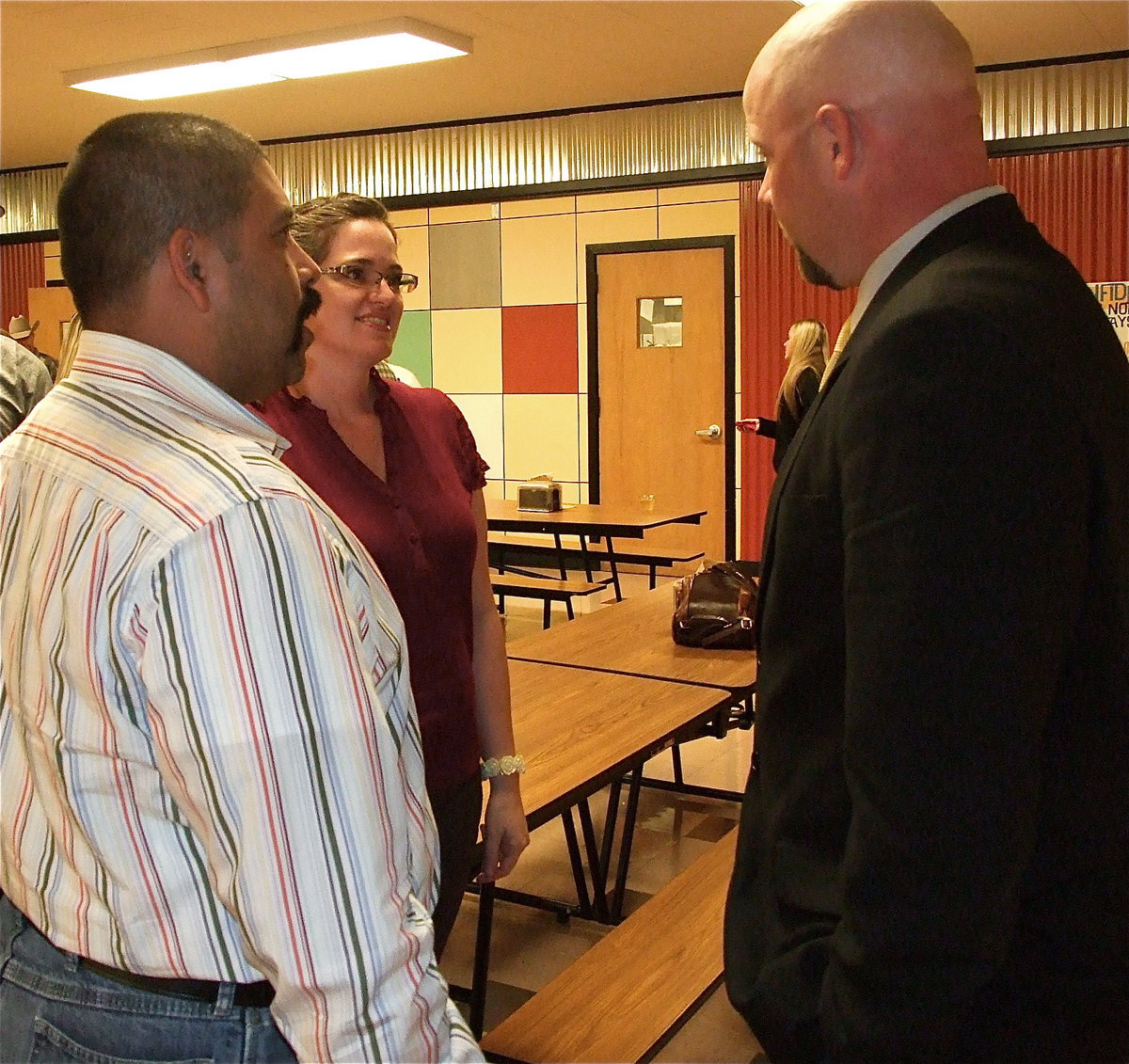 Image: Albert Garcia, Jr. and his wife Davee greet Coach Hank Hollywood. 