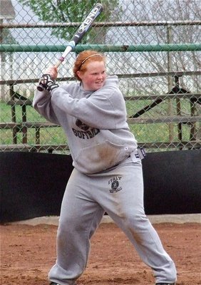 Image: Junior Lady Gladiator Katie Byers enjoys walloping softballs around the yard.