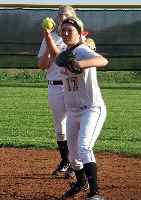 Image: Senior pitcher Megan Richards is poised for a run for the title as she gets warmed up before the Axtell game.