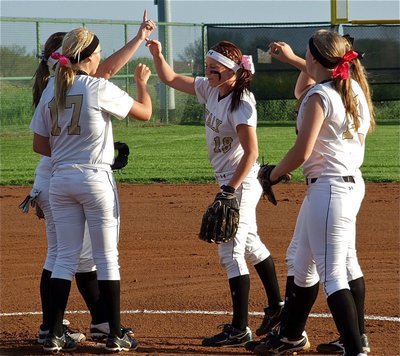 Image: The Lady Gladiator infield brings it in after getting their first out of the contest.
