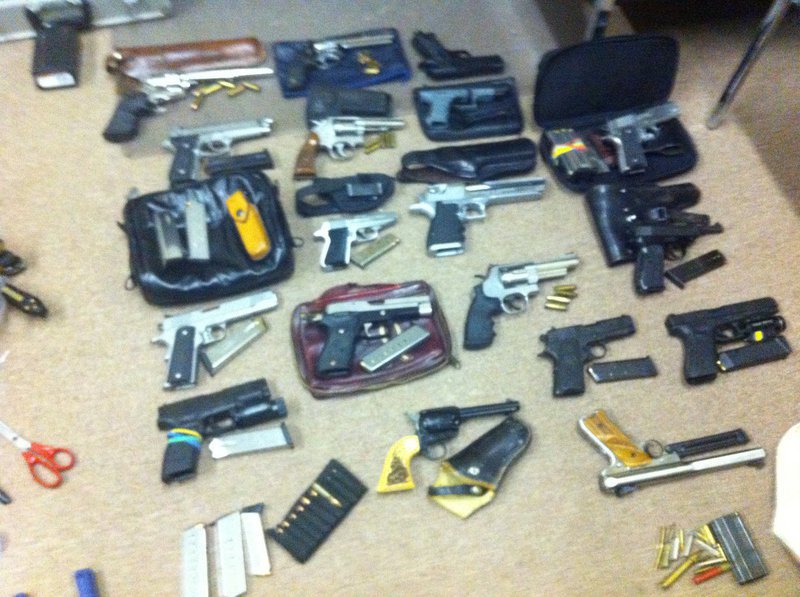 Image: Recovered stolen property including at least 18 loaded handguns and over 100 knives.