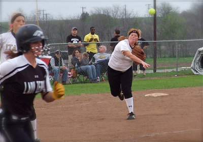 Image: Italy’s third baseman Katie Byers(13) throws a Grandview runner out at first base.