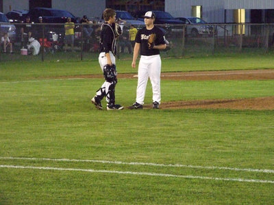 Image: Ross Stiles and Justin Buchanan talk on the mound.