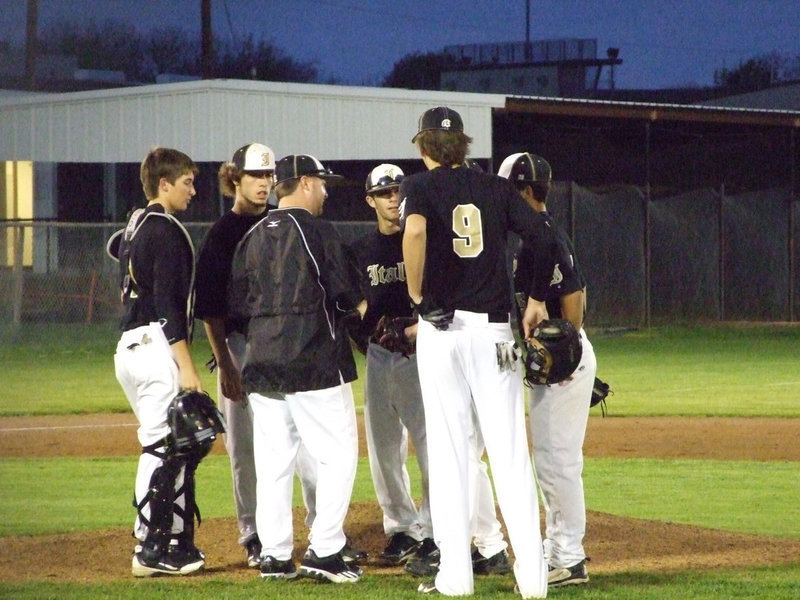 Image: Coach Josh Ward talks to the infield.