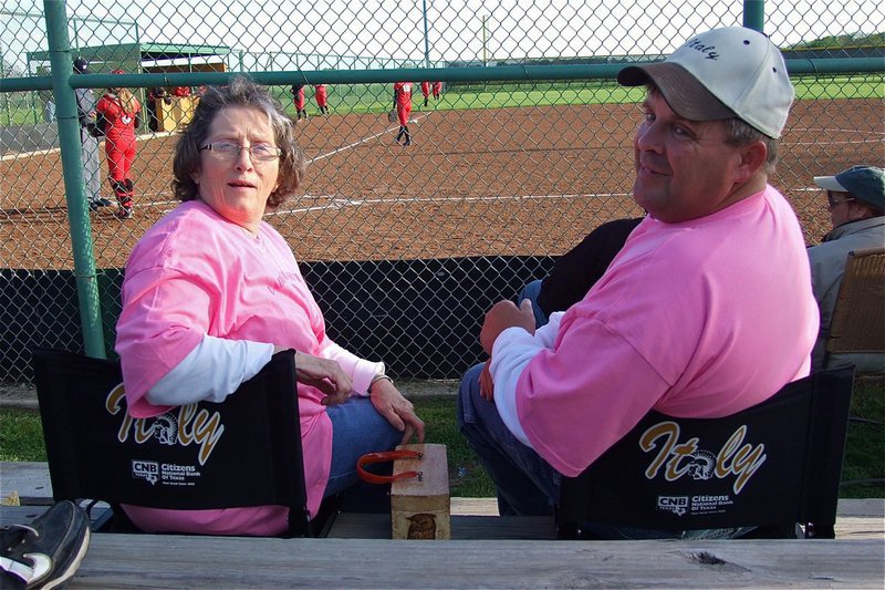 Image: Honored guest Karen Mathiowetz and her husband Brian Mathiowetz don matching pink shirts and matching Italy bleacher seats while watching Italy and Maypearl duke it out on the diamond.