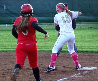 Image: Jaclynn Lewis(15) had a solid game at first base and collects another put-out against Maypearl.