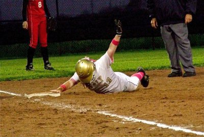 Image: Katie Byers(13) respectfully requests a moment to catch her breath and then get to her feet after successfully stealing third base. Apparantly, it’s uphill between second and third base.:))